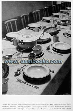 table at a DAF School set with red-rimmed white porcelain manufactured by Gebrüder Bauscher of Weiden